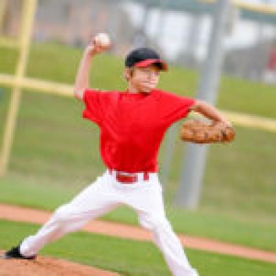 Kid throwing baseball