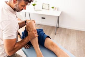 Therapist helping patient