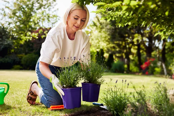 woman kneeling in garden